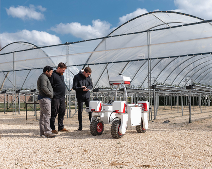 LIAT researchers using a robot