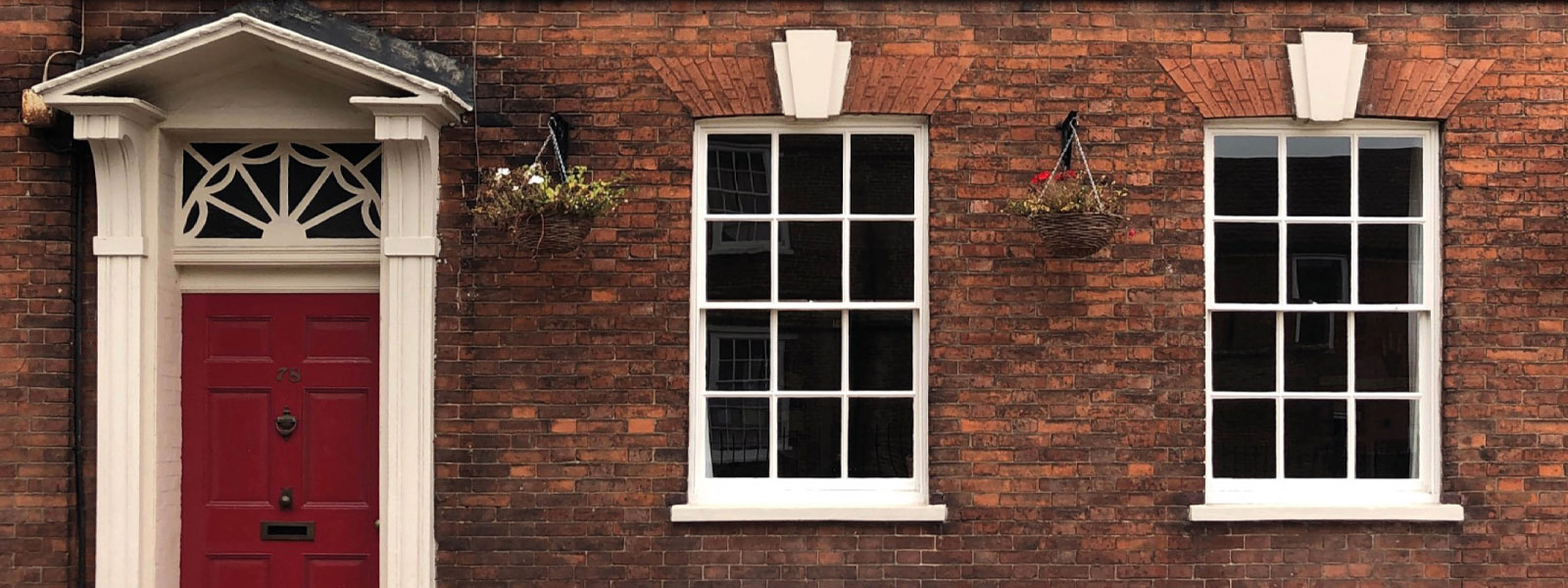 Outside an old building with a door and windows